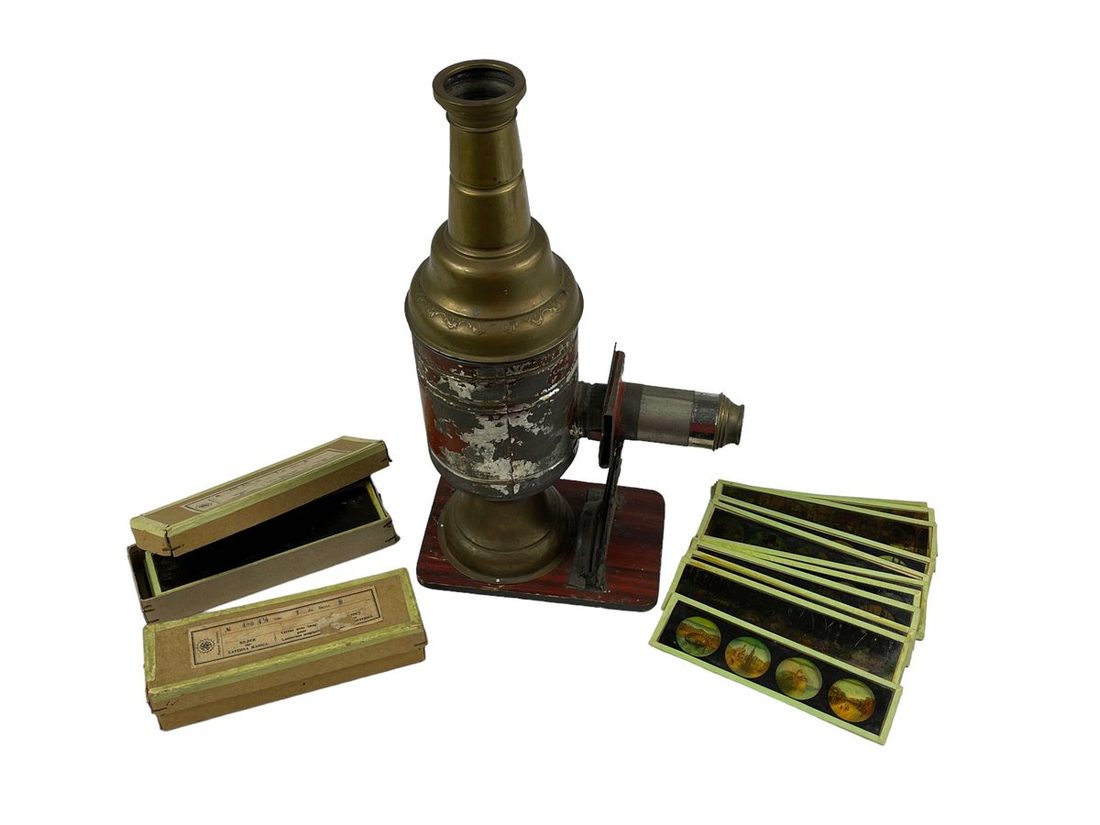 A magic lantern with its painted glass slides, here in the small domestic form the device took in later centuries.