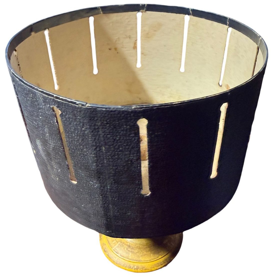 A zoetrope drum: sequential images watched through the moving slits.